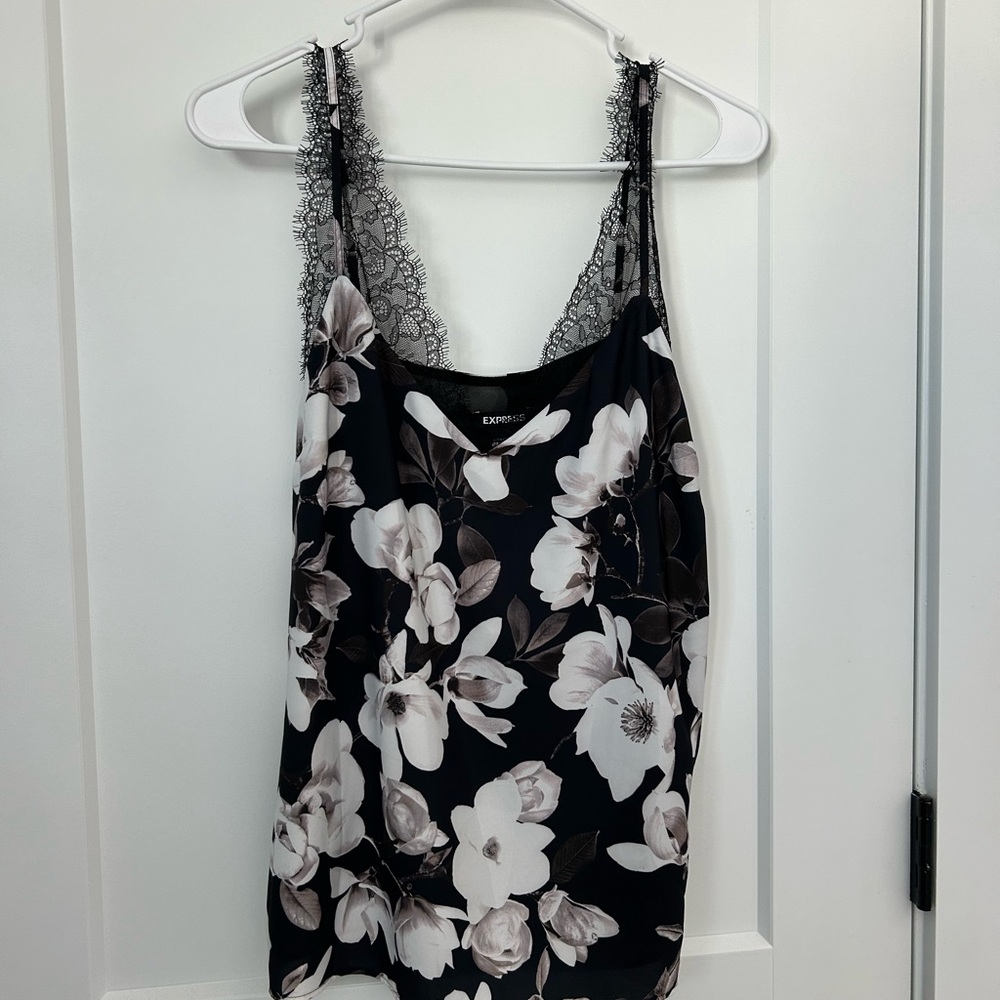 Express Woman’s Dressy Black Tank with white flowers
Size M